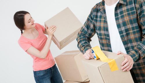 Professional movers handling flat removals in Stockwell on a residential street