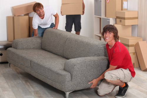 Packed office boxes and furniture ready for removal in Stockwell