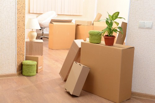 Removal specialists loading belongings during a house move in Stockwell